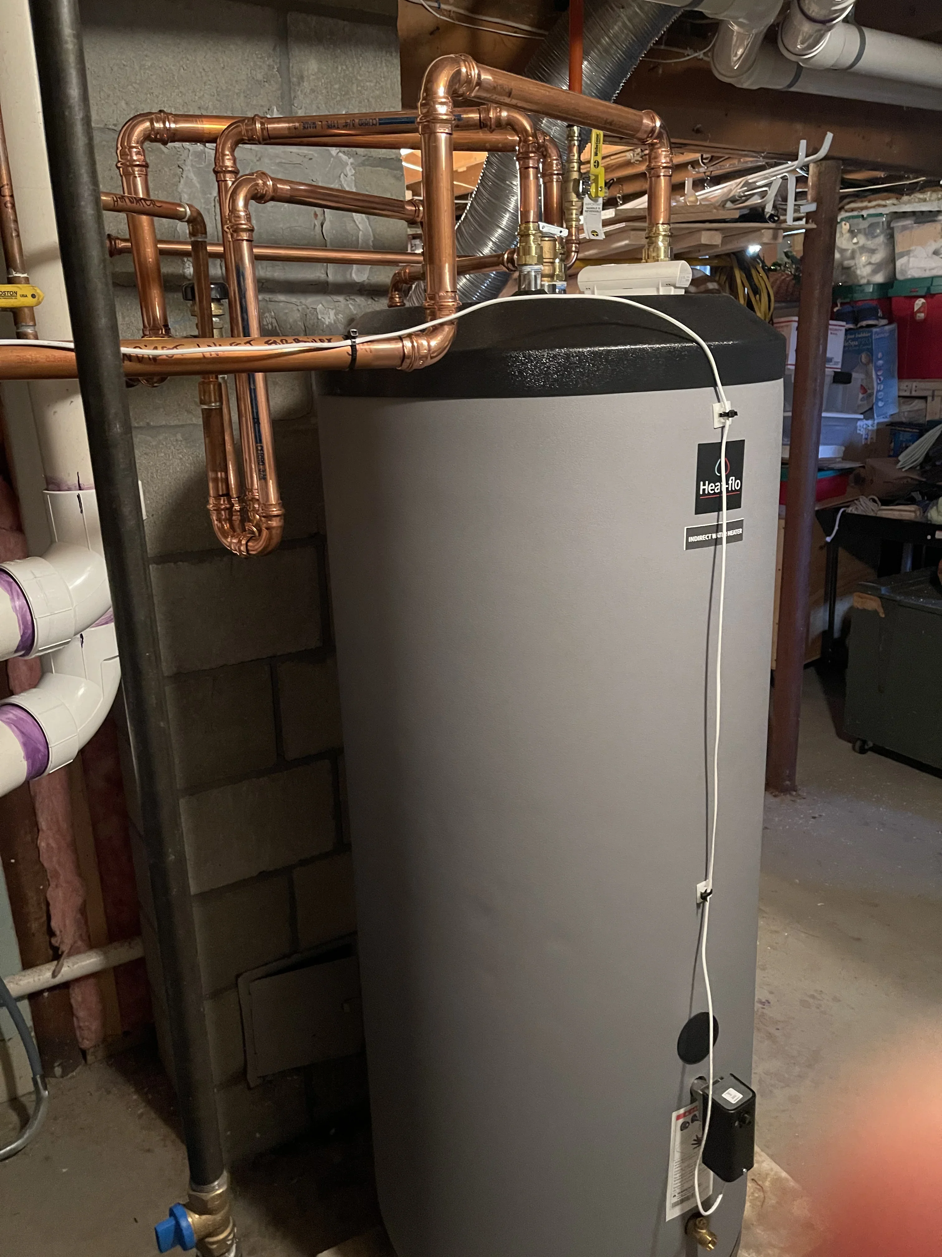 Heizflo water heater with copper piping installation and fittings in mechanical room